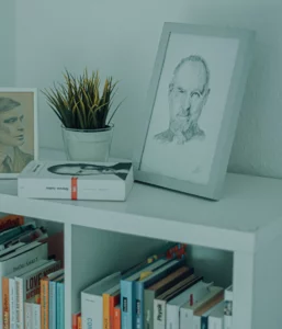 Steve Jobs picture in a frame on a bookshelf LinkedIn