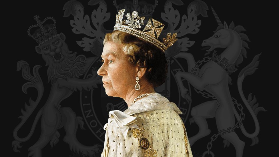 Queen Elizabeth II in front of a royal crest