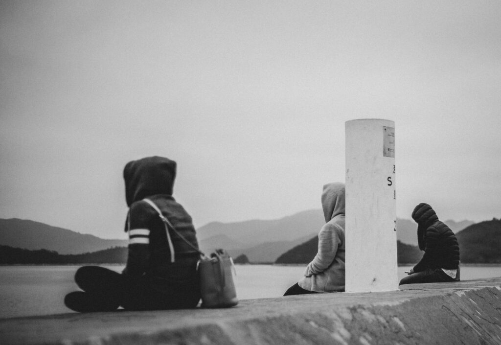 black and white hoodie sitting thinking