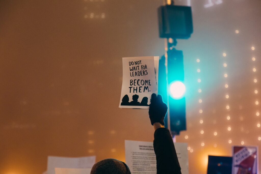 a person raises a manifesto to the light