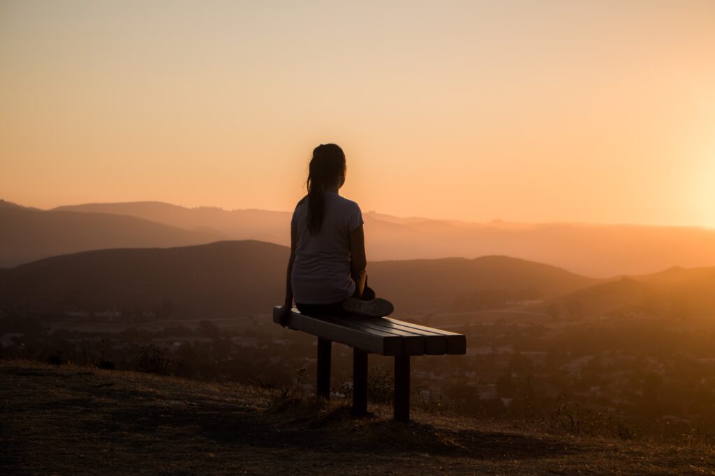 a person meditates at the golden hour